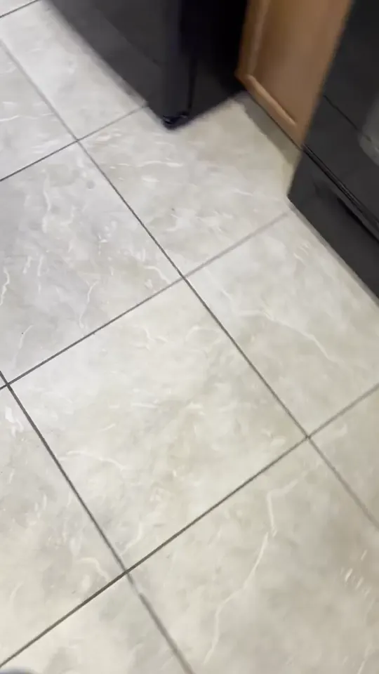 Light ceramic kitchen tile floor from a similar grout cleaning job