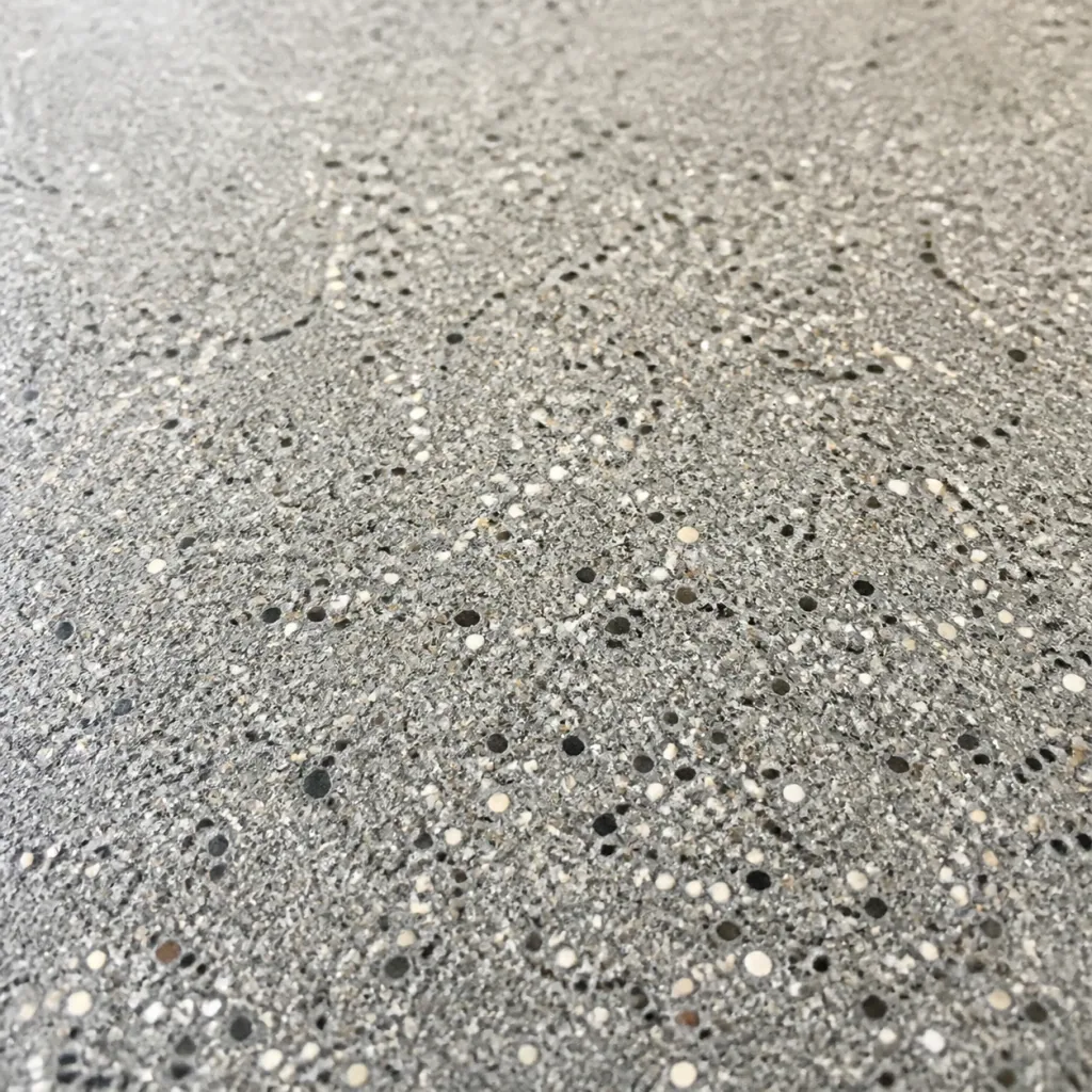Representative close-up of concrete with fine salt-and-pepper aggregate exposure