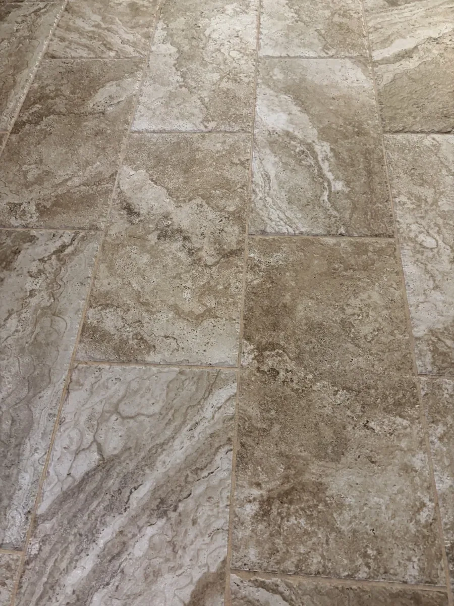 Close detail of filled cross-cut travertine with natural movement