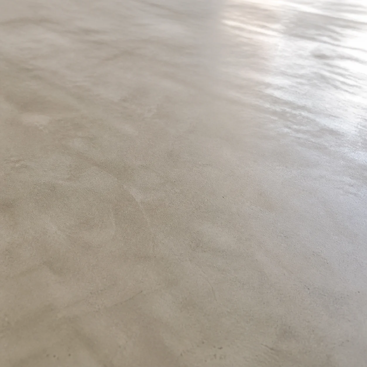 Representative close-up of cream-finish concrete with almost no exposed aggregate