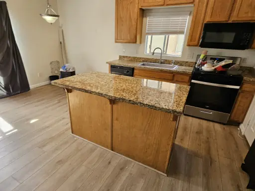 Granite kitchen countertop restored to an even polished finish in an East Valley home