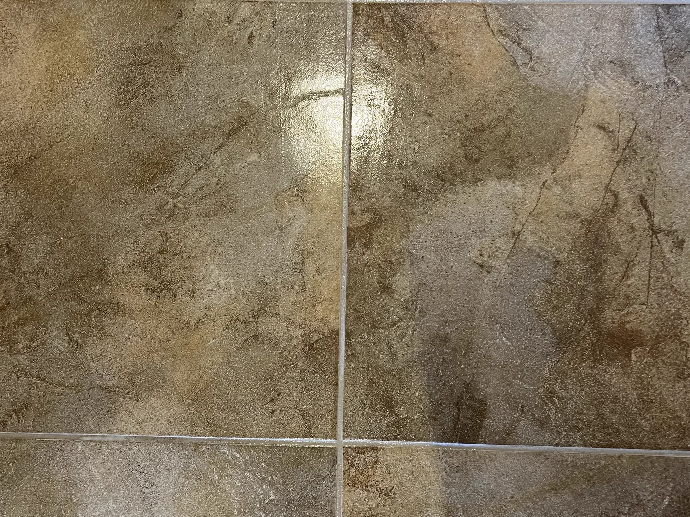 Close view of clean travertine floor tile and the grout joints between them